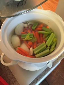 Adding veggies for soup while making bone broth.